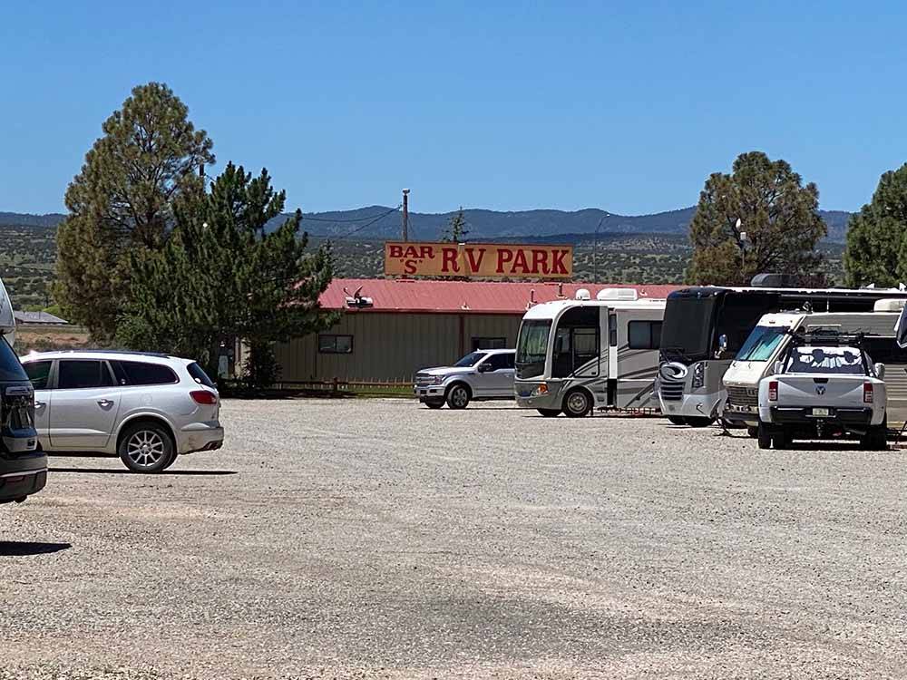 Paved parking lot outside main building at BAR S RV PARK