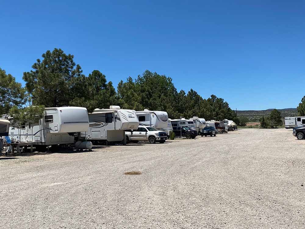 Gravel road with RVs parked in distance at BAR S RV PARK