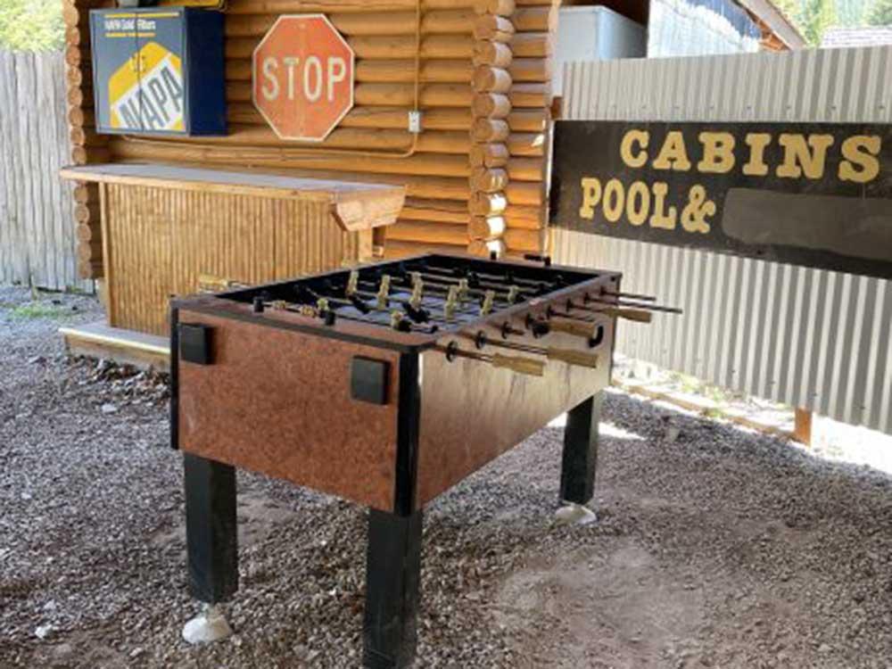 An foosball table under a covered outdoor area at THE NUGGET RV RESORT