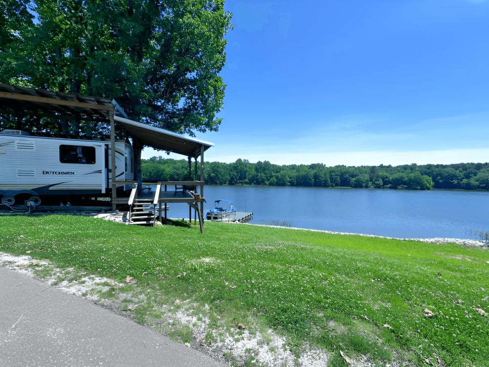 RV parked with lake view at Beech Lake Family Camping Resort