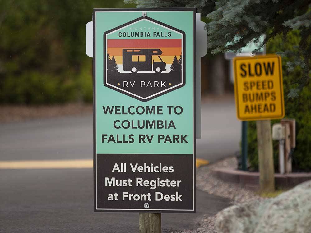 A Welcome sign at the entrance at COLUMBIA FALLS RV PARK