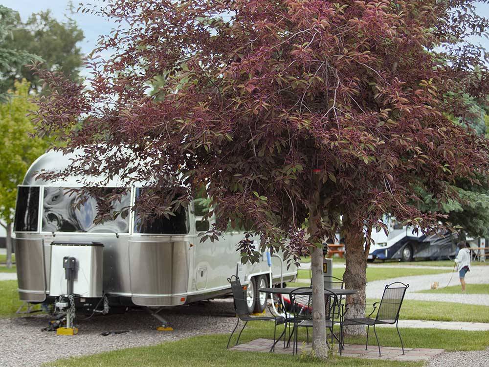 An Airstream trailer in a gravel site at COLUMBIA FALLS RV PARK