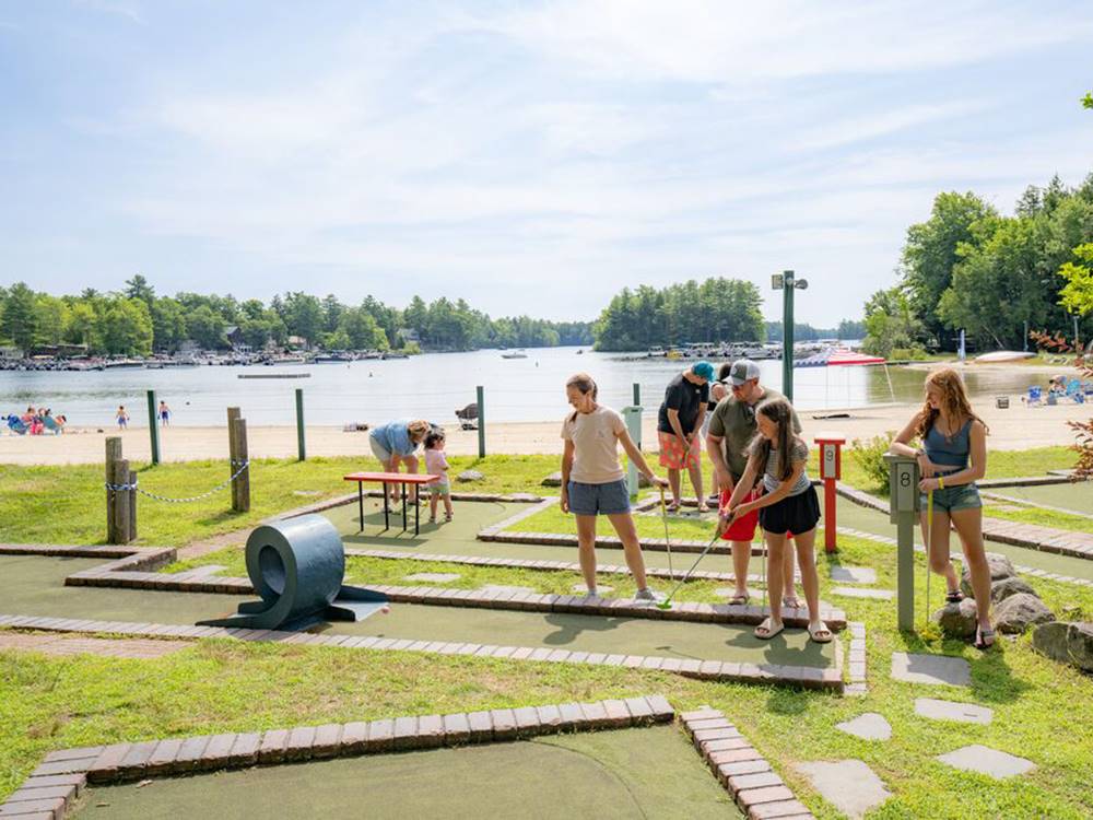 People playing mini golf