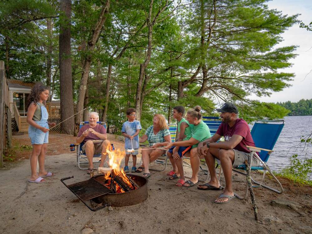A multi generational family roasting marshmallows