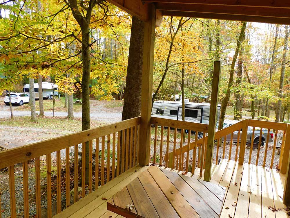 A wooden deck overlooking the RV sites at WOODSMOKE CAMPGROUND