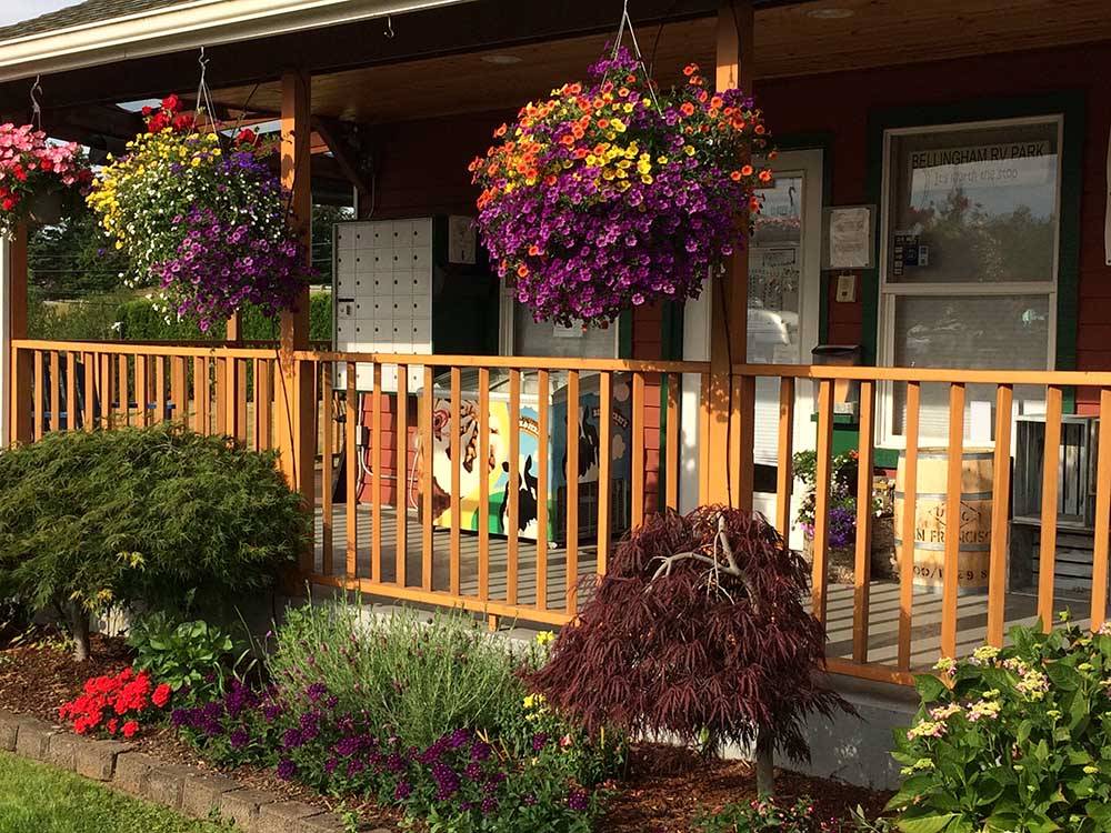 Hanging flowers and porch outside main building at BELLINGHAM RV PARK