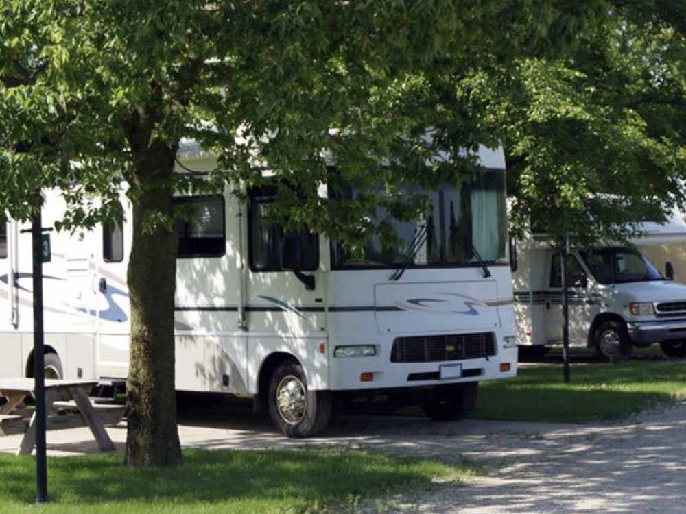 Class A parked under shade trees at RV PARK AT HOLLYWOOD CASINO JOLIET