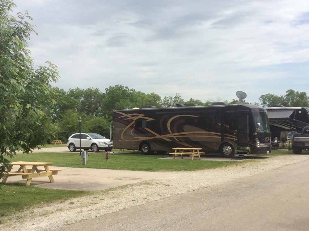 Open RV site next to parked motorhomes at RV PARK AT HOLLYWOOD CASINO JOLIET