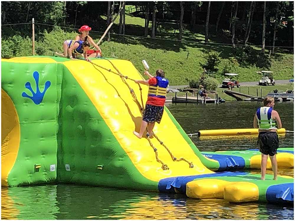 Kids playing on inflatable Wibit Sports at AUSTIN LAKE RV PARK & CABINS
