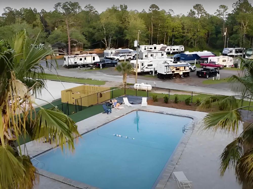 Aerial view of swimming pool at Pelican Palms RV Park