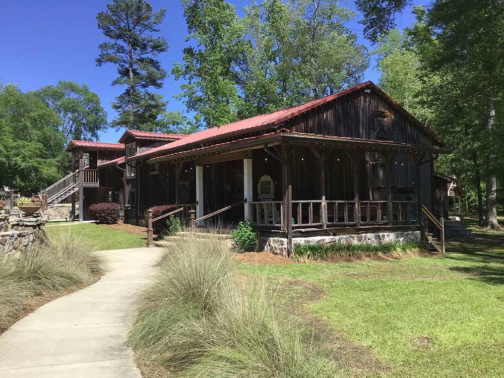 A large wooden building at LAKE PINES RV PARK & CAMPGROUND
