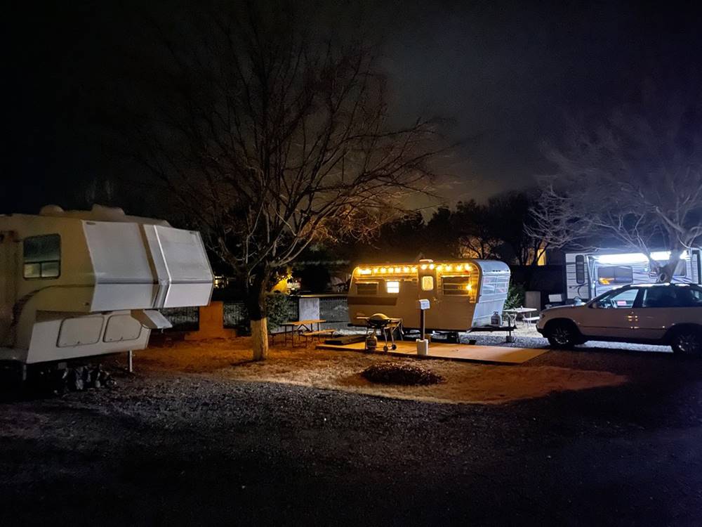 Lit trailer at night at Rancho Verde RV Park