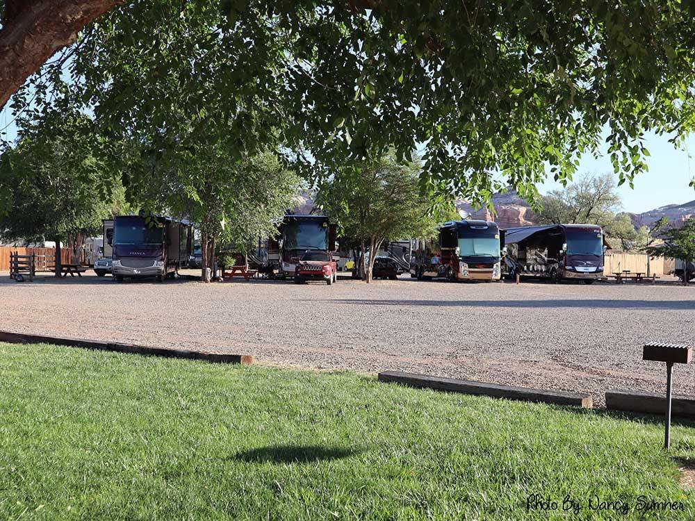 Motorhomes parked in gravel sites at COTTONWOOD RV PARK