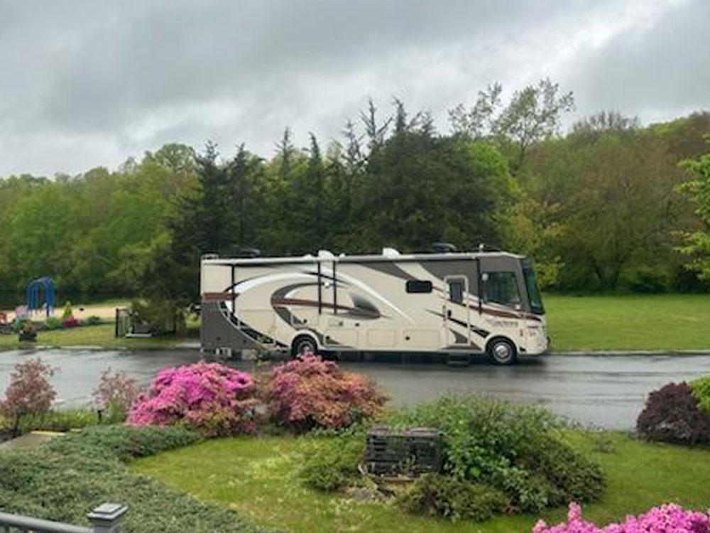 RV parked near pink flowers at ACES HIGH RV PARK AND RESORT