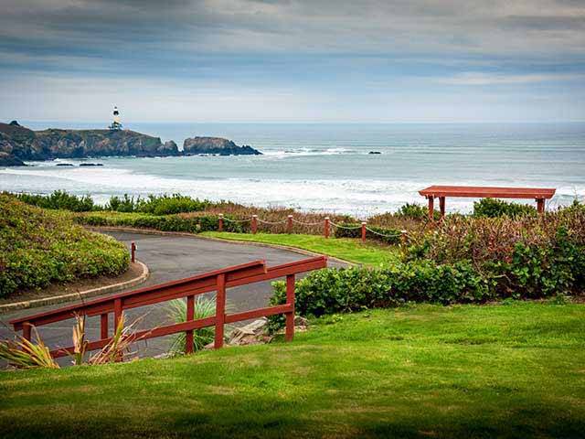 At the other end of the resort, a paved path leads to to the beach & views of the Yaquina Head Light