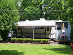 RV with awning and lights - thumbnail