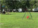 A swing set and children's playground at SOUTH FORTY RV CAMPGROUND - thumbnail