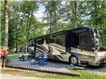 Class A Motorhome at campsite at COLUMBUS WOODS-N-WATERS KAMPGROUND - thumbnail