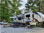 Fifth wheel towable parked onsite at COLUMBUS WOODS-N-WATERS KAMPGROUND - thumbnail