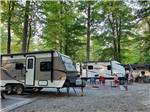 RVs set up for camping at COLUMBUS WOODS-N-WATERS KAMPGROUND - thumbnail