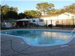 View larger image of Pool surrounded by fence for safety at SAFARI MOBILE HOME  RV COMMUNITY image #4