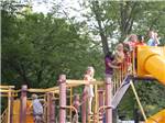 Kids in line to use the slide at the playground at Indiana Beach Campground - thumbnail