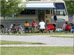 A family hanging out at their RV site at Indiana Beach Campground - thumbnail