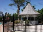 A gazebo in the swimming pool area at COUNTRY MANOR RV & MH COMMUNITY - thumbnail