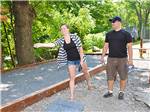 View larger image of Man and woman playing horseshoes at MOUNTAIN VISTA CAMPGROUND image #10