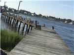 Pier leading to water at TOM'S COVE PARK - thumbnail