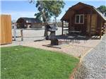 Lodging with outdoor seating and grill at GRAND JUNCTION KOA - thumbnail