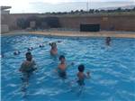 People playing in the swimming pool at GRAND JUNCTION KOA - thumbnail