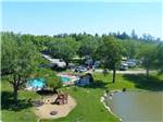 View larger image of Swimming pool and playground on the lake at campground at BEYONDER GETAWAY AT SLEEPY HOLLOW image #1