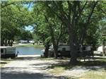 View larger image of Shaded campsites lining road to the lake at BEYONDER GETAWAY AT SLEEPY HOLLOW image #8
