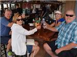 View larger image of A group of adults drinking at CAMPLAND ON THE BAY image #5