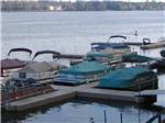 View larger image of A groupp of boats on the dock at LAKE DUBAY SHORES CAMPGROUND image #8