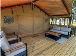 Outdoor deck seating in the glamping tent - thumbnail