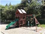 View larger image of Wooden playground in the sand at RAPID CITY RV PARK AND CAMPGROUND image #10