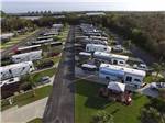 Aerial view of trailers and cars parked at RV sites at UPRIVER RV RESORT - thumbnail