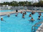 People exercising in one of the pools at UPRIVER RV RESORT - thumbnail