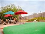 Putting green with outdoor seating at ENCORE SUNI SANDS - thumbnail