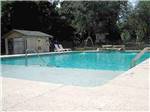View larger image of Swimming pool with lodging at SAVANNAH OAKS RV RESORT image #3