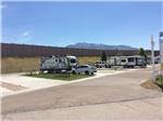 View larger image of A row of paved pull thru RV sites at CENTURY RV PARK  CAMPGROUND image #8