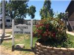 View larger image of The welcome sign next to a flower bin at CENTURY RV PARK  CAMPGROUND image #10