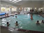 Families enjoying the indoor swimming pool at CAPE KIWANDA RV RESORT & MARKETPLACE - thumbnail