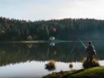 A man fishing in a lake - thumbnail