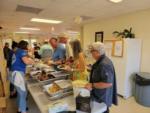 View larger image of People lining up for a buffet at PORT ST LUCIE RV RESORT image #5