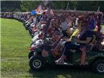 A long row of decorated golf carts at EAGLE CLIFF CAMPGROUND & LODGING - thumbnail