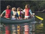 A family paddling a canoe at EAGLE CLIFF CAMPGROUND & LODGING - thumbnail