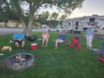 People around a fire pit at MEADOWS OF SAN JUAN RV RESORT - thumbnail